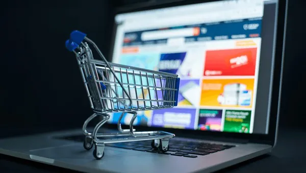 small-shopping-cart-on-laptop-600nw-2459651035